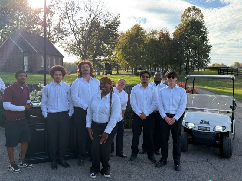 The Parking Guys valet team in white shirts and black slacks with an EZGO guest shuttle cart at a private horse farm in Paris, Kentucky