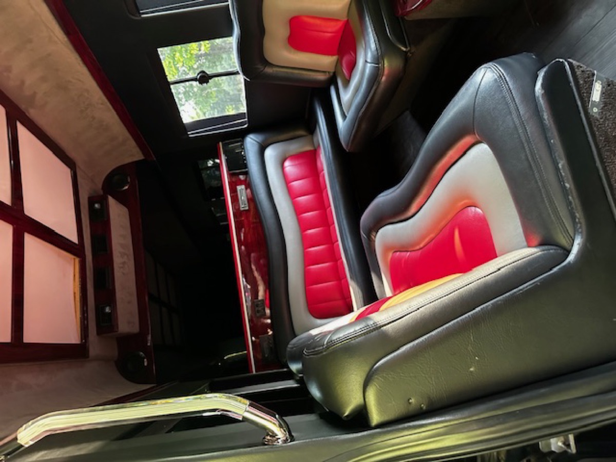 Sprinter interior — black and red leather rear bench seating