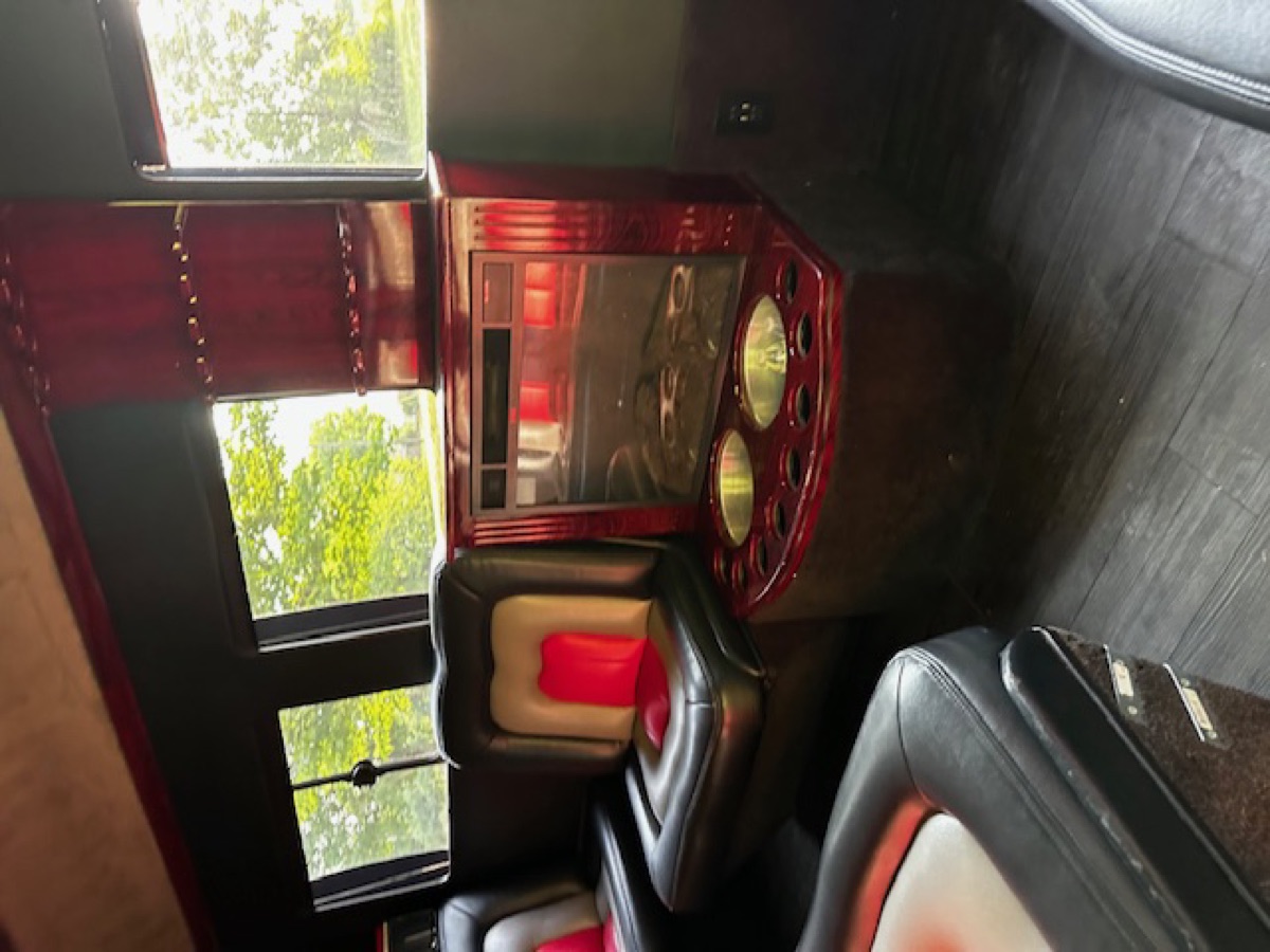 Sprinter interior — bar console with chilled beverage service and individual lounge seats