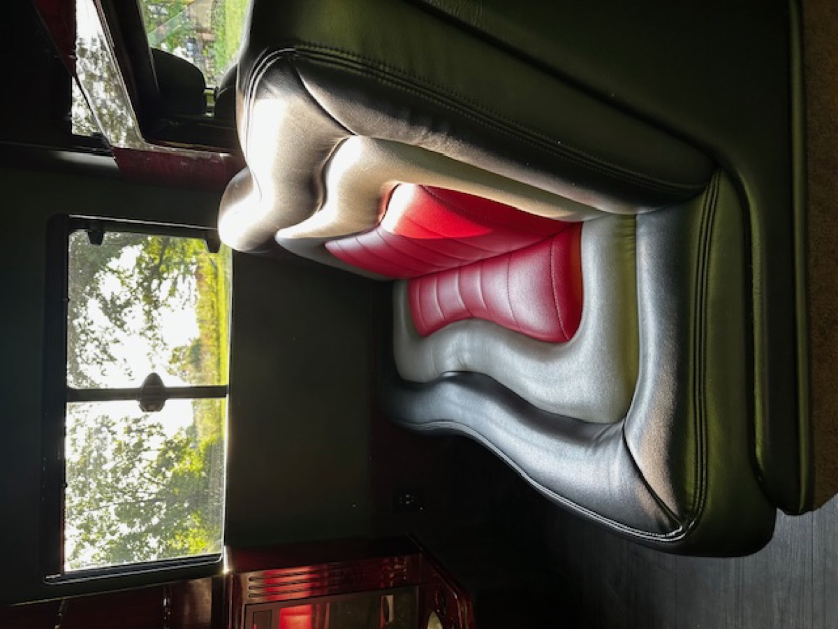 Sprinter interior — bench seating with mirrored ceiling and ambient lighting